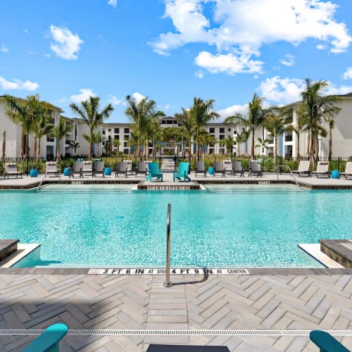a pool with chairs around it