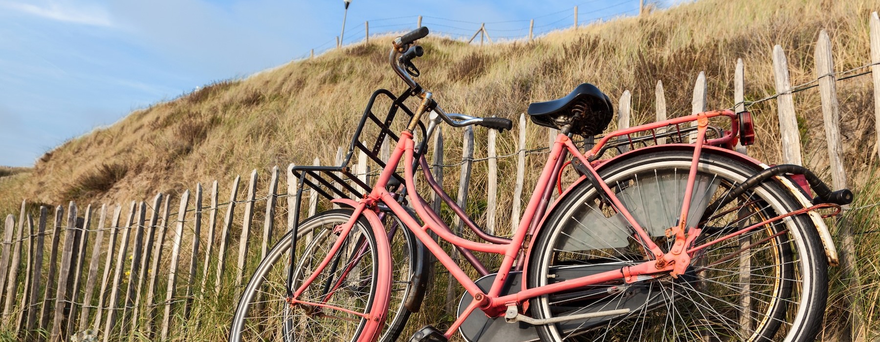 a bicycle parked on a fence